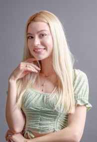 a woman with long blonde hair posing for a picture