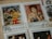 A collection of vintage postage stamps featuring artworks and portraits. One stamp displays a person in a vibrant red garment, surrounded by natural scenery. Another features a woman with red hair, adorned in an elegant dress, posing thoughtfully. Additional stamps feature monochromatic portraits of individuals from history.