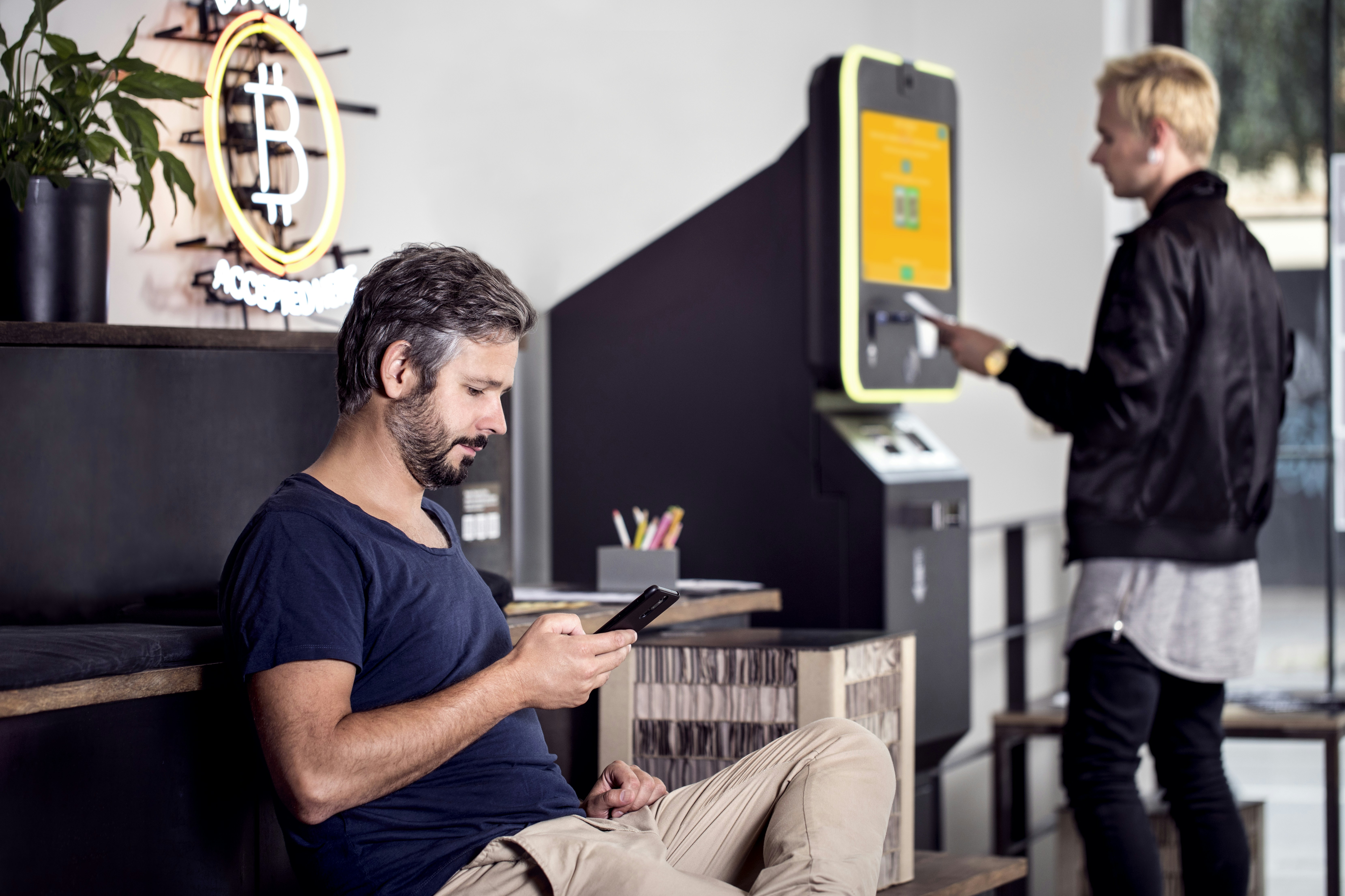 Man purchase Bitcoin from a 2-way Bitcoin ATM