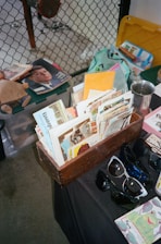 A collection of historical 3D stereoscopic cards displayed on a wooden table.