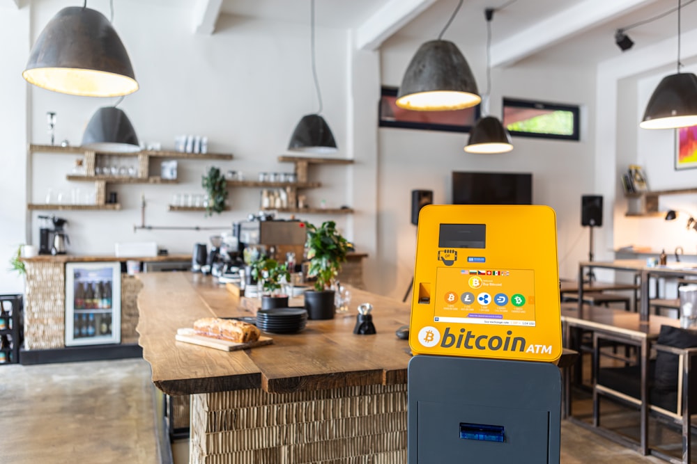 a coin machine sitting on top of a wooden counter