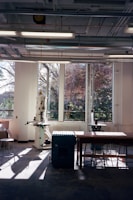 Brightly lit workshop showcasing various laser-cut parts ready for shipment.