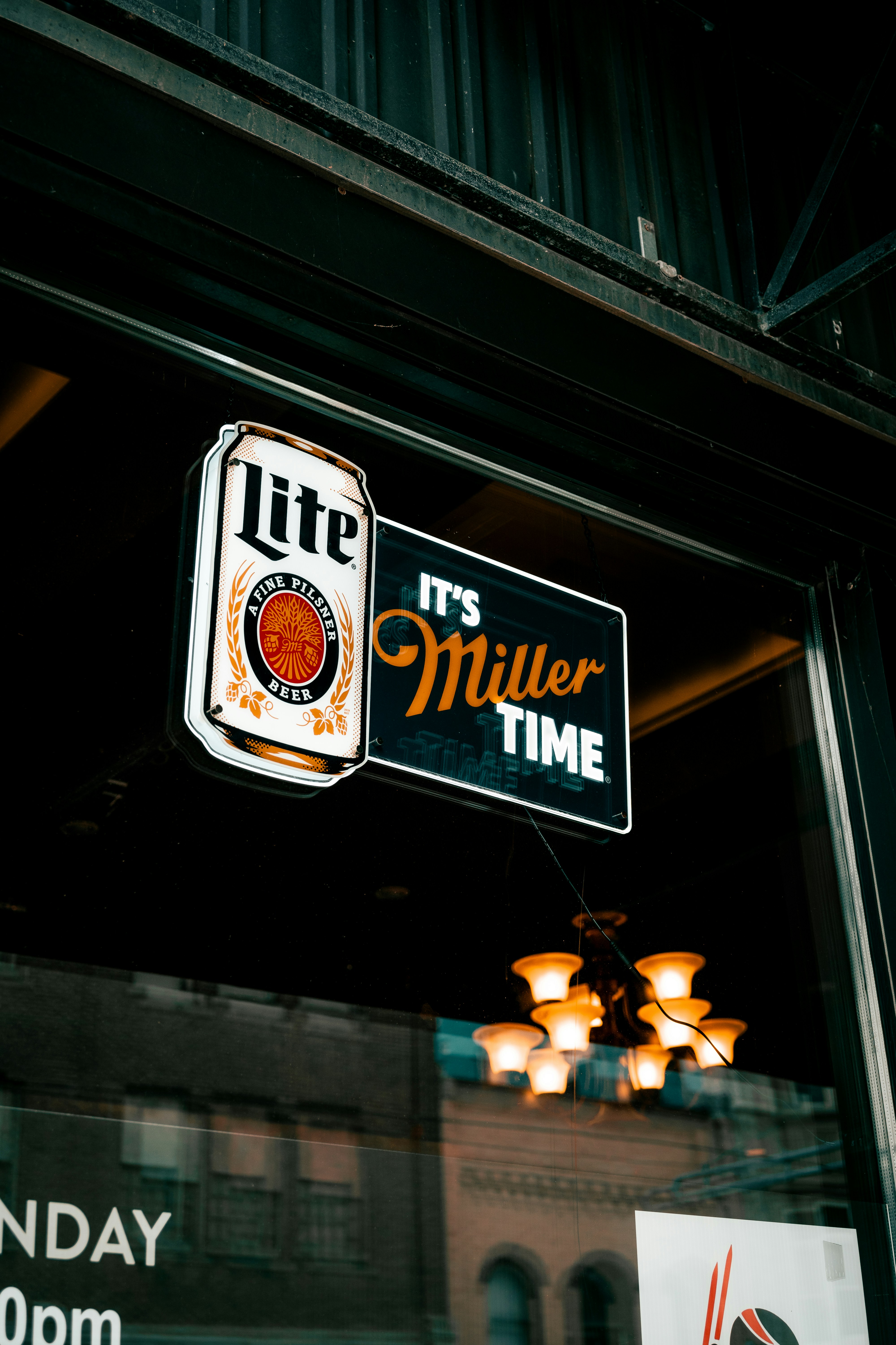 a sign hanging from the side of a building