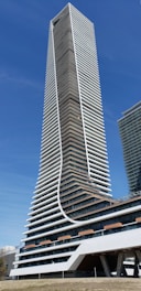 a very tall building sitting next to a very tall building