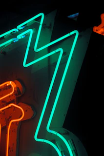 Close-up of neon tubes glowing with vibrant colors, emphasizing craftsmanship.