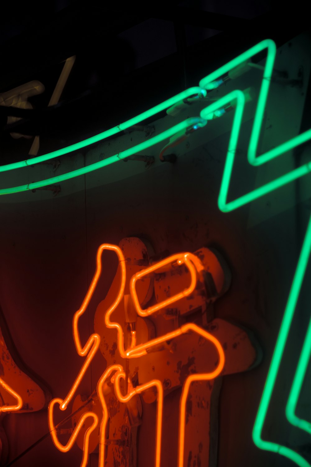 a neon sign that is on the side of a building