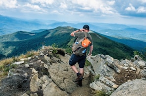 A scenic view of a hiking trail with a backpack and water bottle.