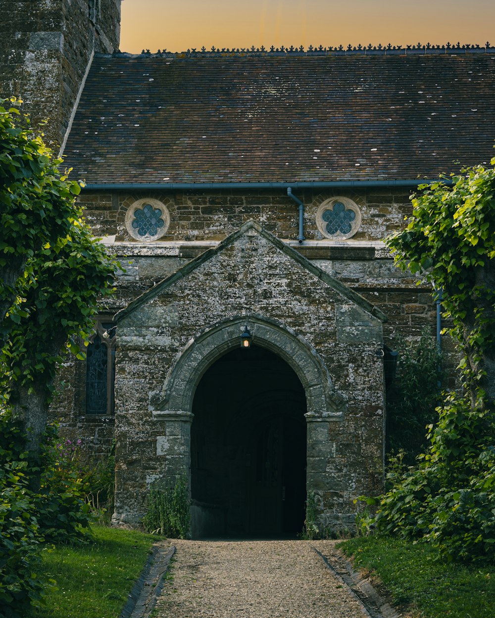 a stone building with a stone pathway leading to it