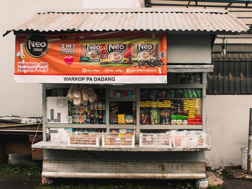 a food stand with a sign on the side of it