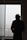 a man standing in front of a window