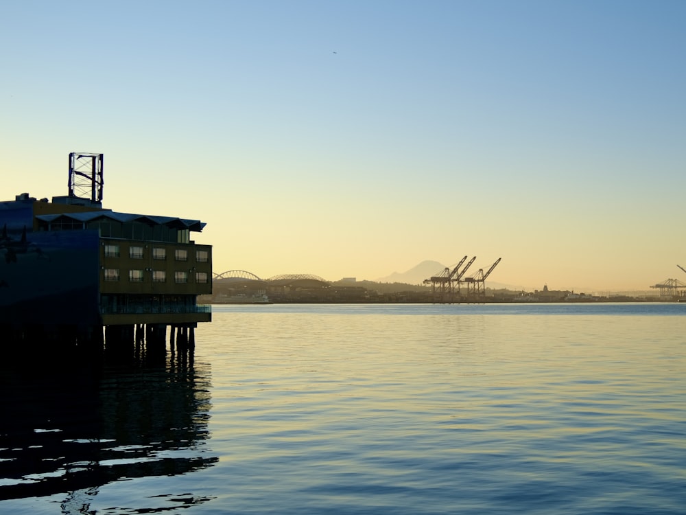 a large body of water with a boat in the distance