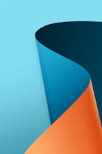 a close up of a curved object on a blue background