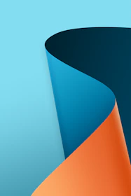 a close up of a curved object on a blue background