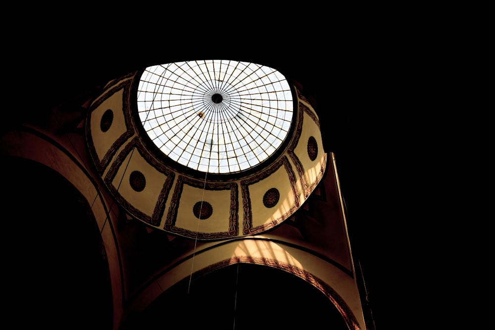 a large clock tower with a skylight in the middle of it