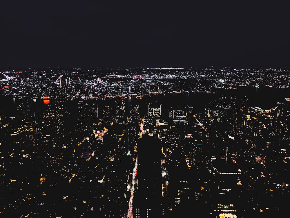 a view of a city at night from the top of a building