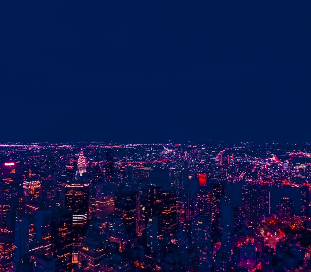 a view of a city at night from the top of a building