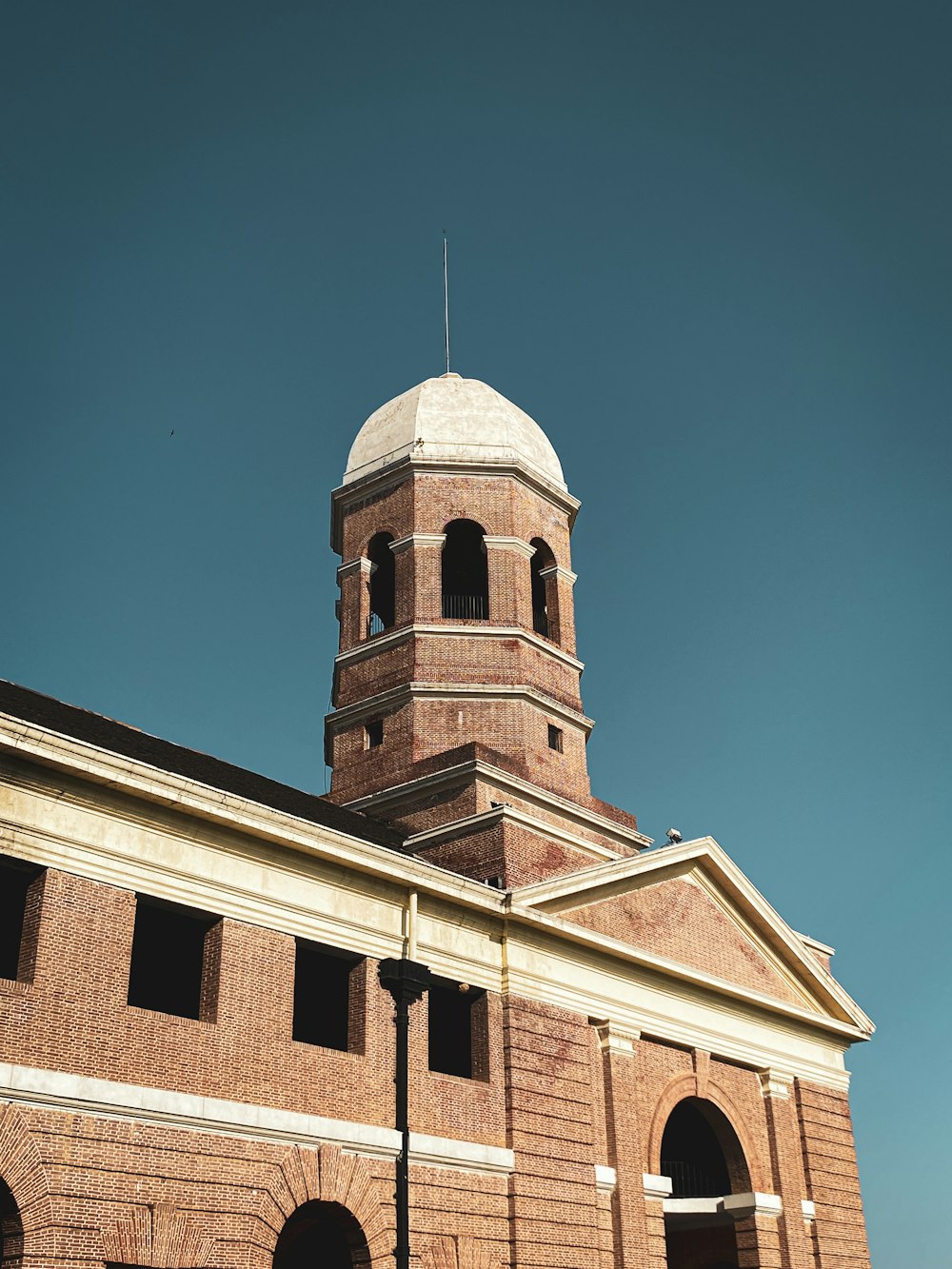 a tall brick building with a clock tower