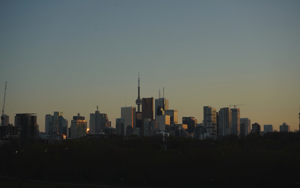 a view of a city skyline at sunset