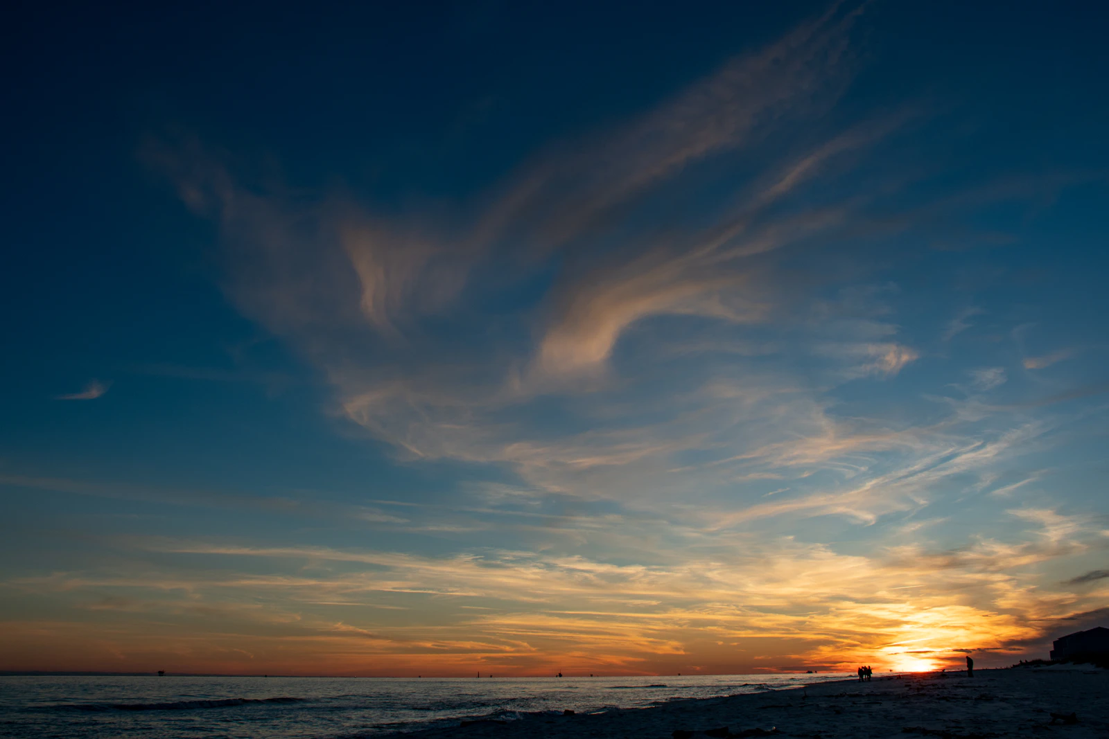 Deep blue offshore water under a wide open sky