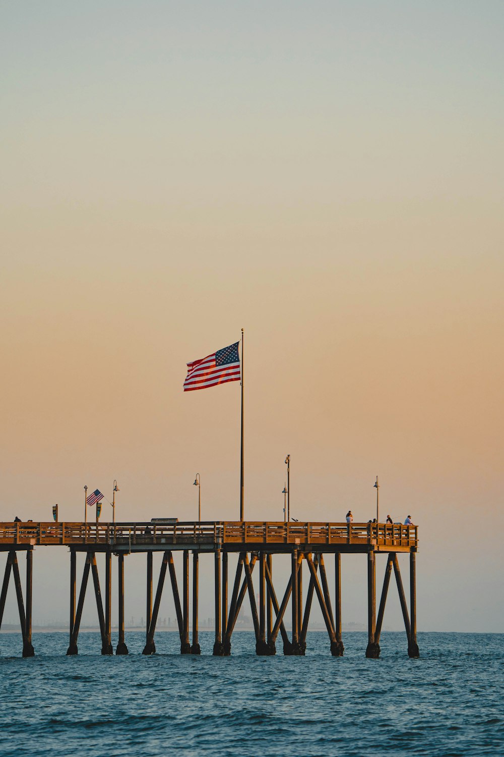 a pier with a flag on top of it