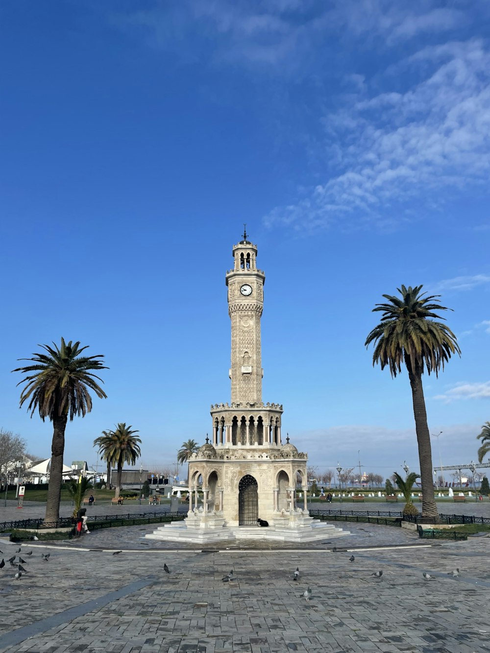 a clock tower in the middle of a park