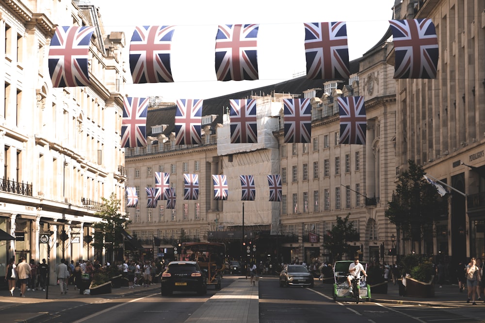 a british flag hanging over a city street