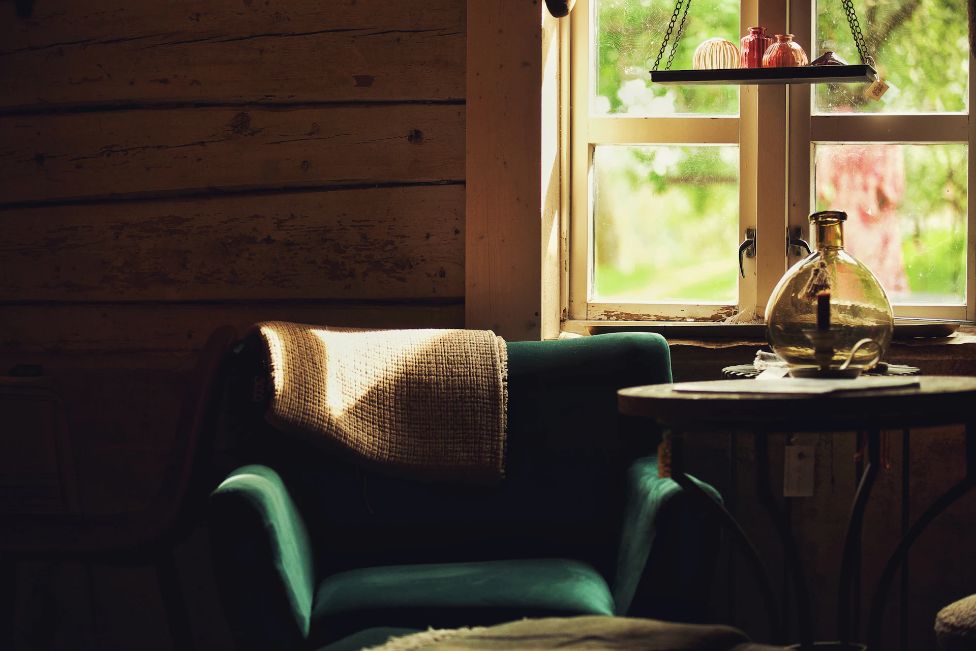 a chair and a table in front of a window