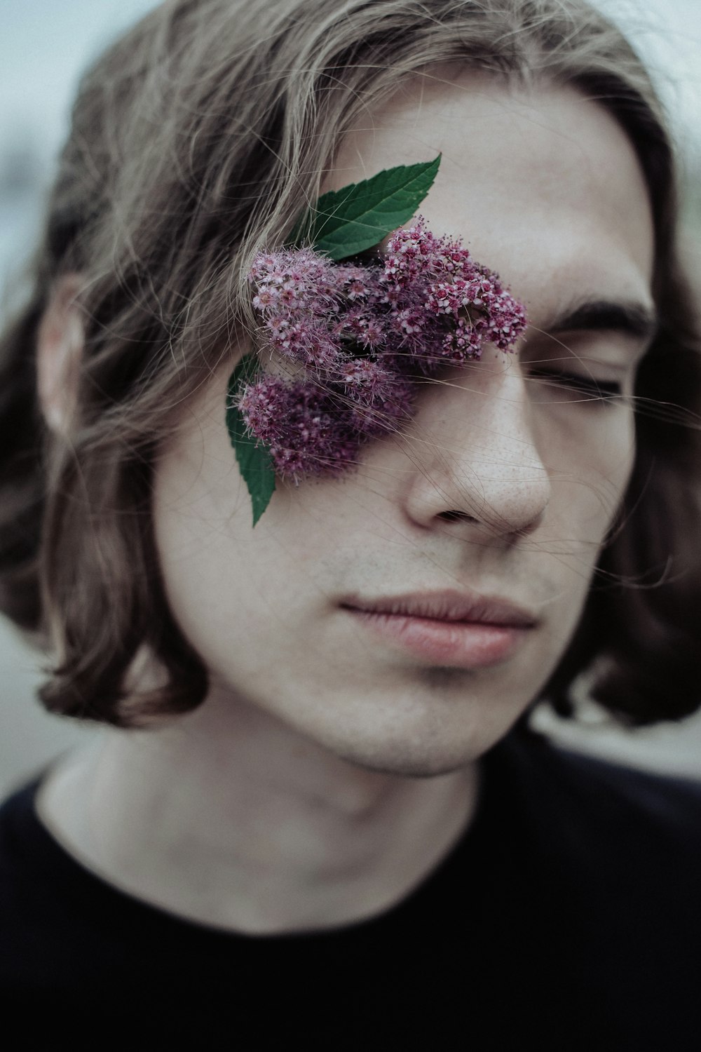 a man with a flower on his forehead