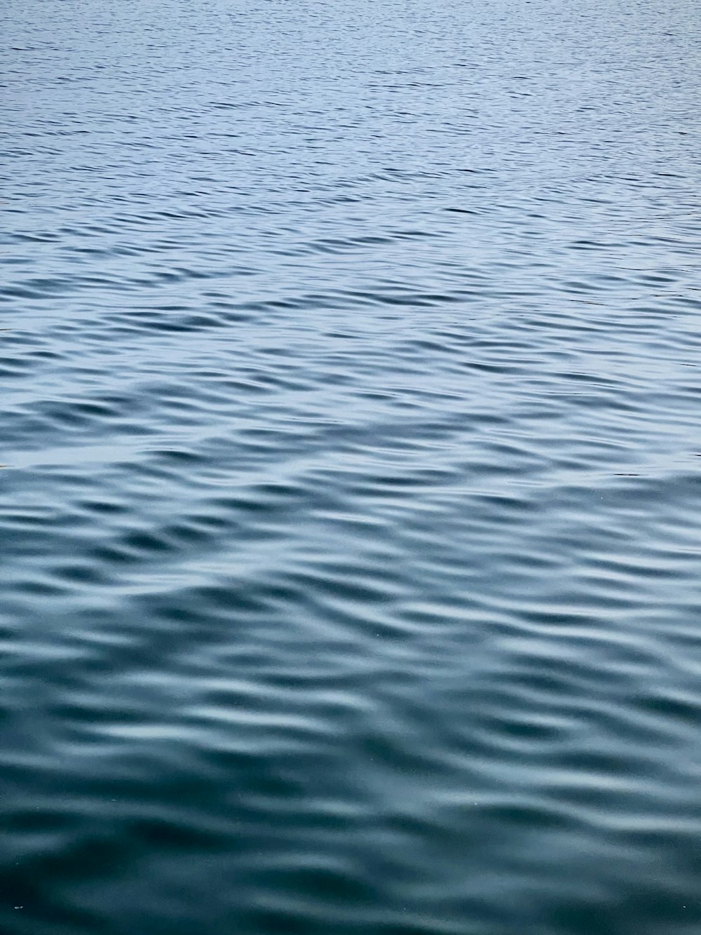 a boat floating on top of a large body of water