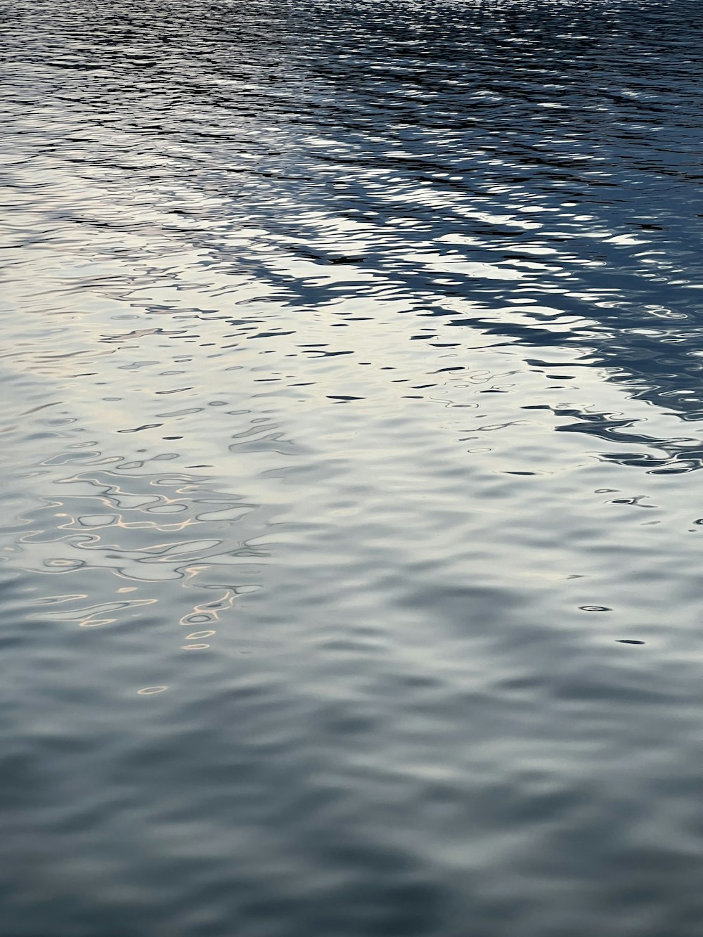 a boat floating on top of a body of water