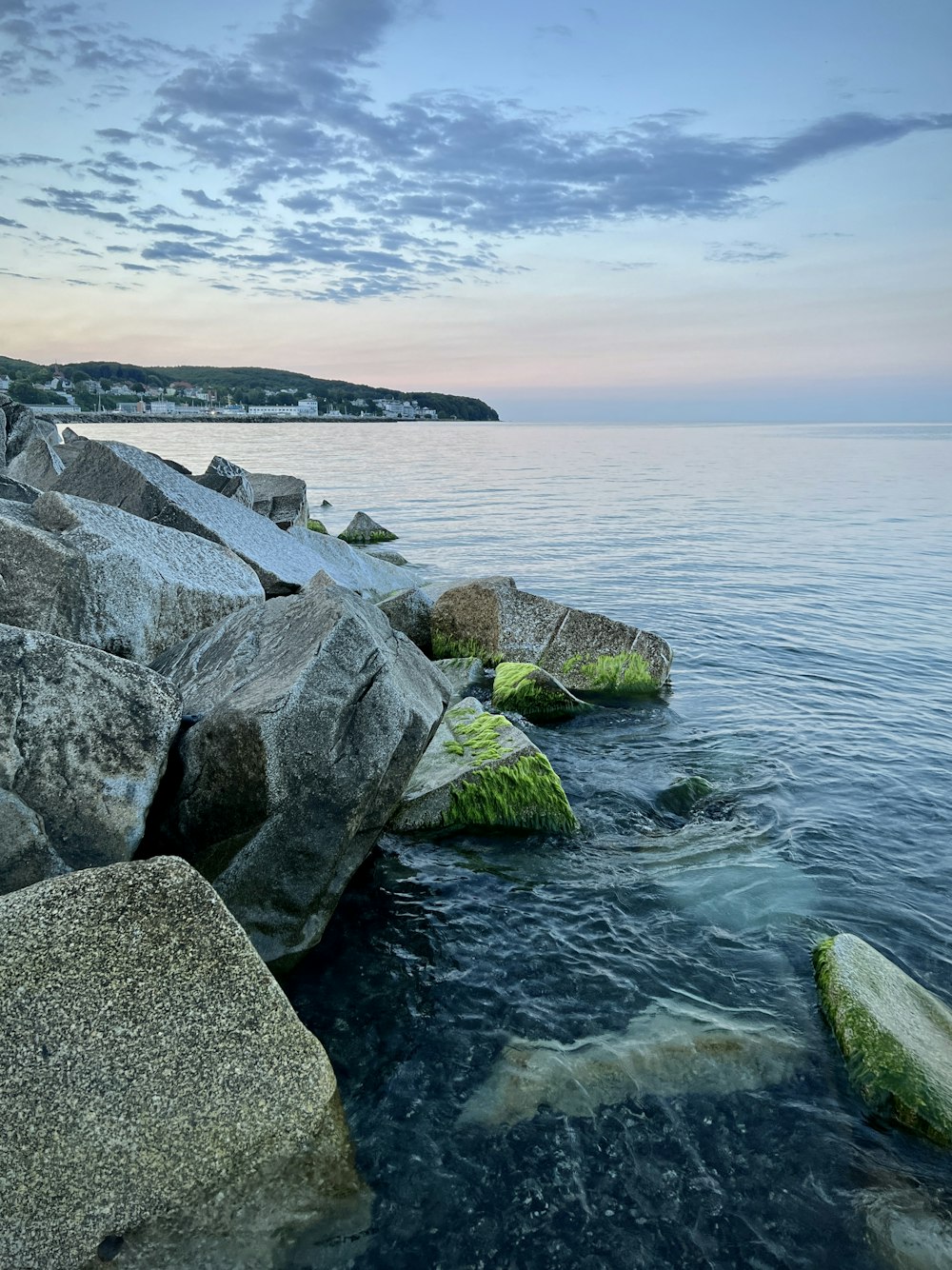 a body of water surrounded by large rocks