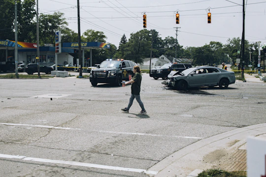 A lawyer reviewing documents with a client after a car accident.