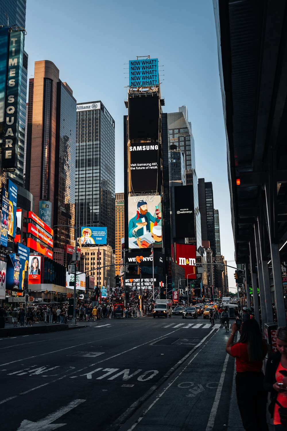 a city street filled with lots of tall buildings