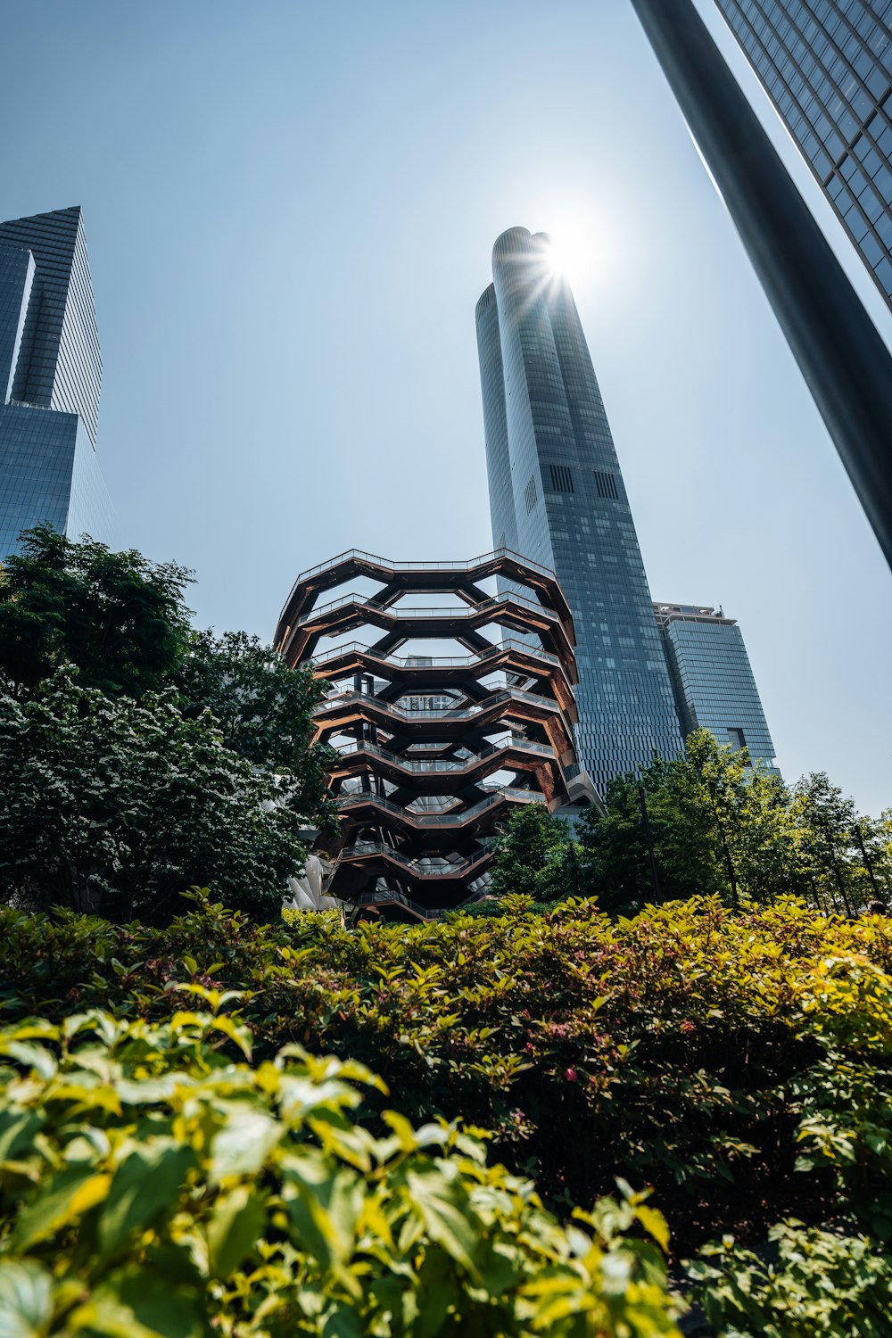 a tall building with a spiral design on top of it