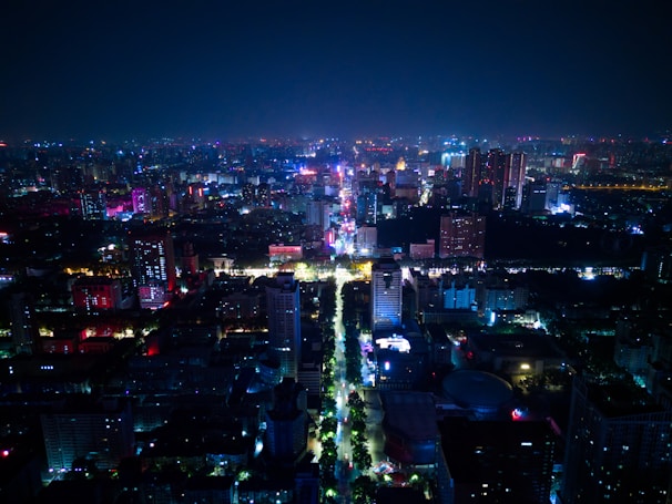 A vibrant cityscape at night, showcasing life and energy.