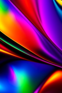 Vibrant waves of color flow across the canvas, blending seamlessly with smooth curves and transitions. The hues range from deep blues to vivid reds, purples, and greens, creating a dynamic and fluid visual experience.