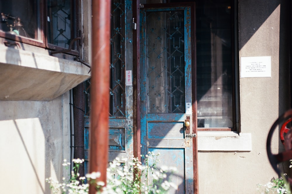 a building with a blue door and window