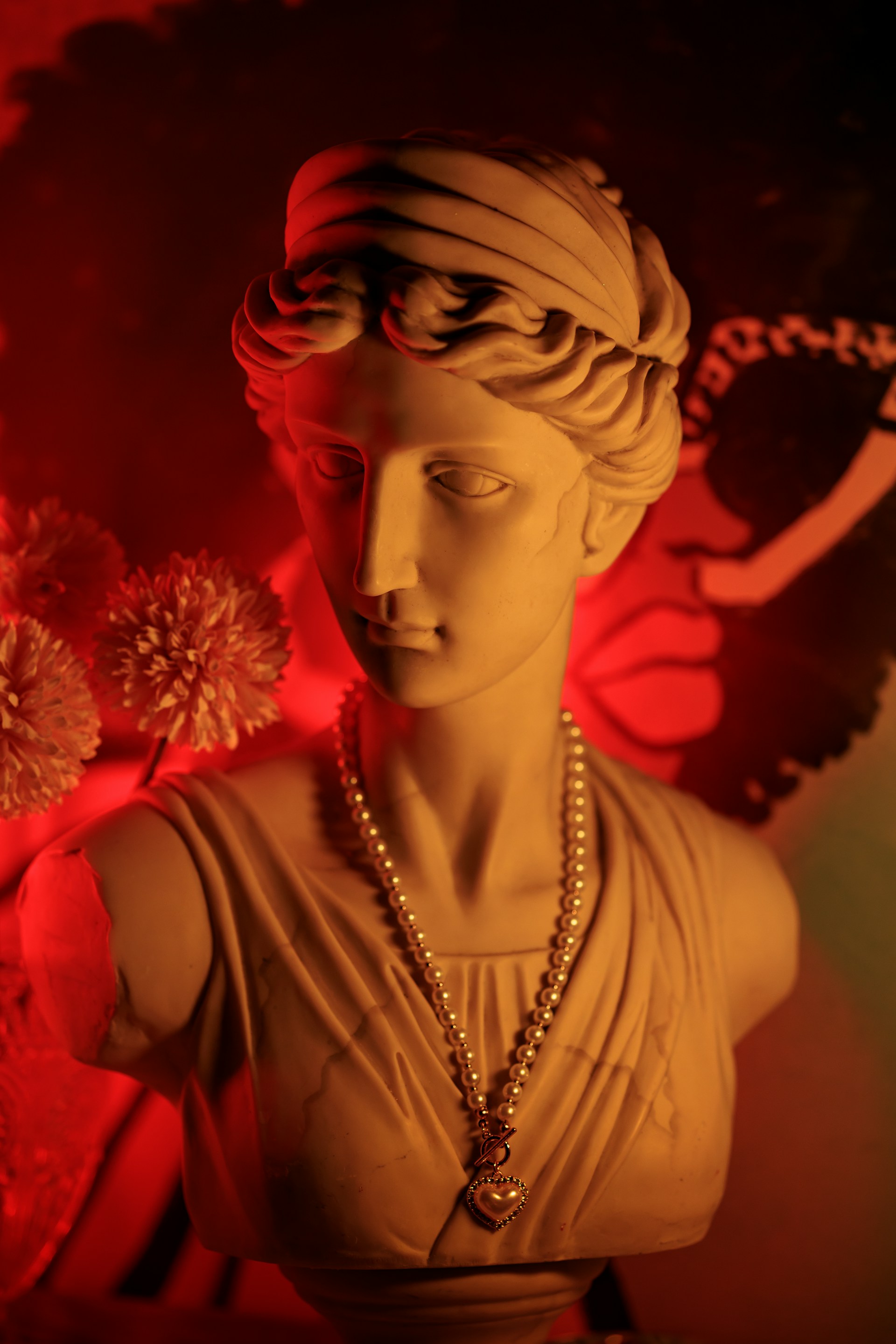 a statue of a woman wearing a necklace