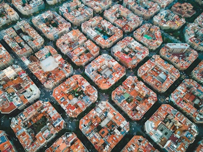 an aerial view of a city with lots of orange buildings