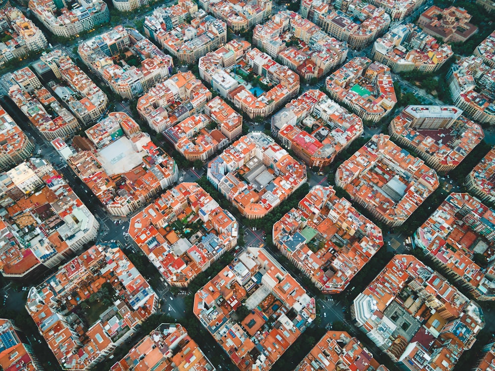 an aerial view of a city with lots of orange buildings