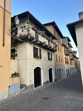 Historic cobblestone street in Prague lined with charming old houses.