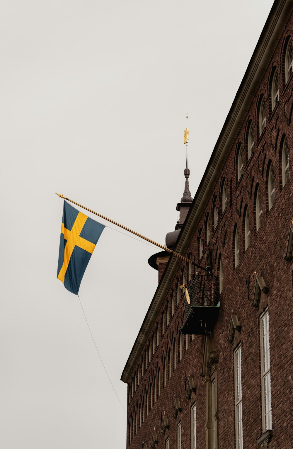 a flag hanging from the side of a building