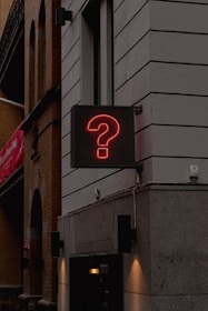 a neon sign on the side of a building