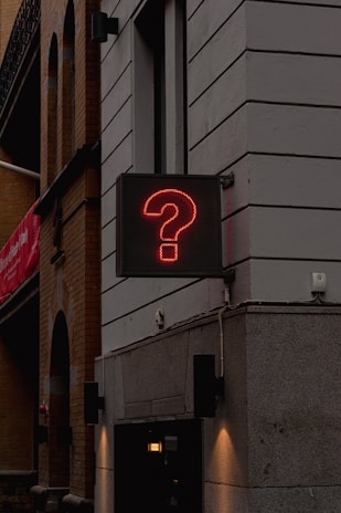 a neon sign on the side of a building