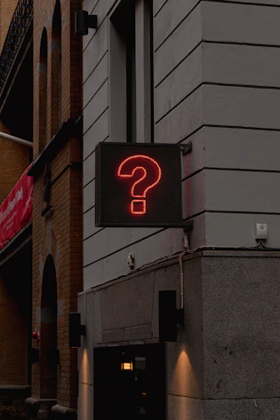 a neon sign on the side of a building