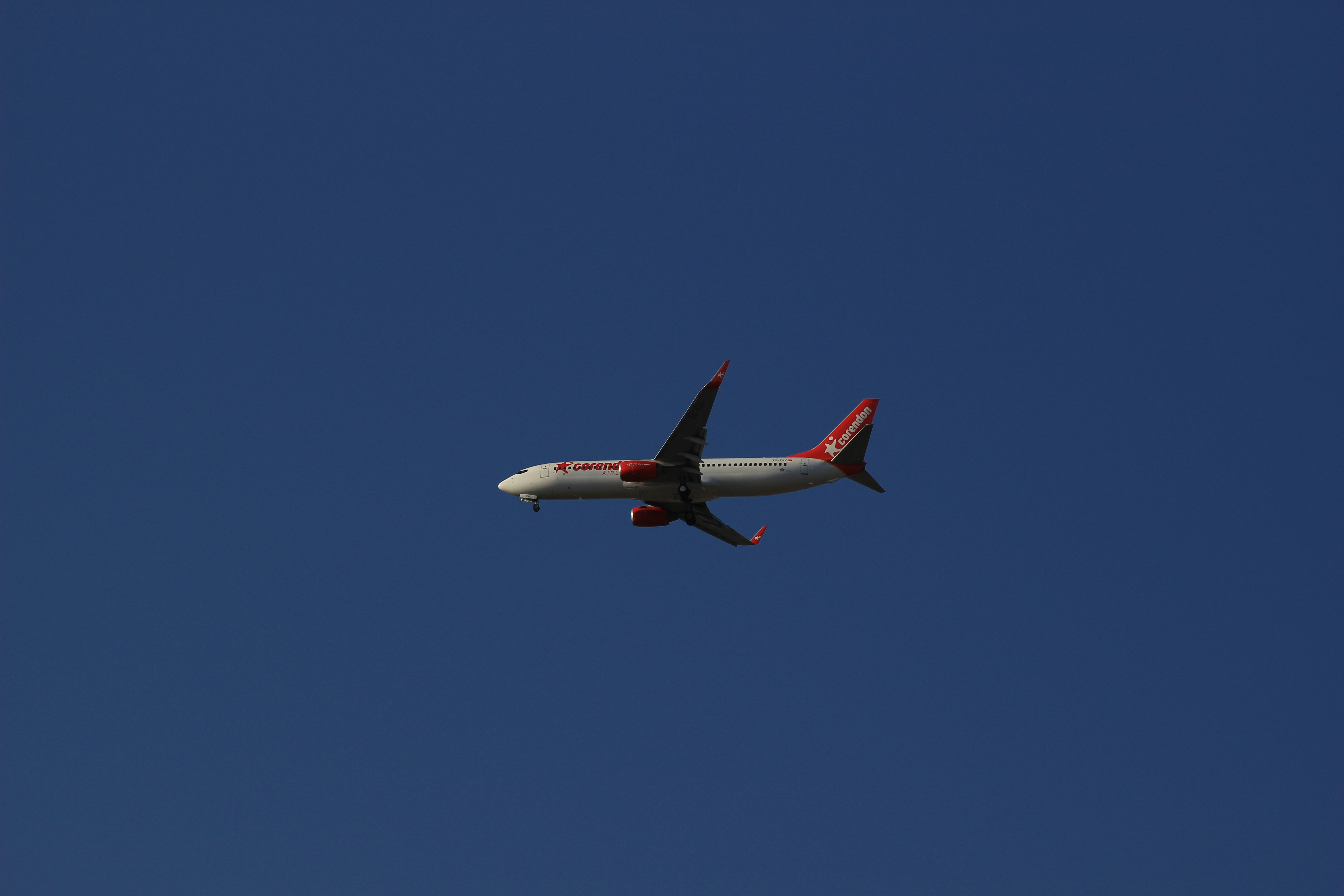 an airplane is flying in a clear blue sky