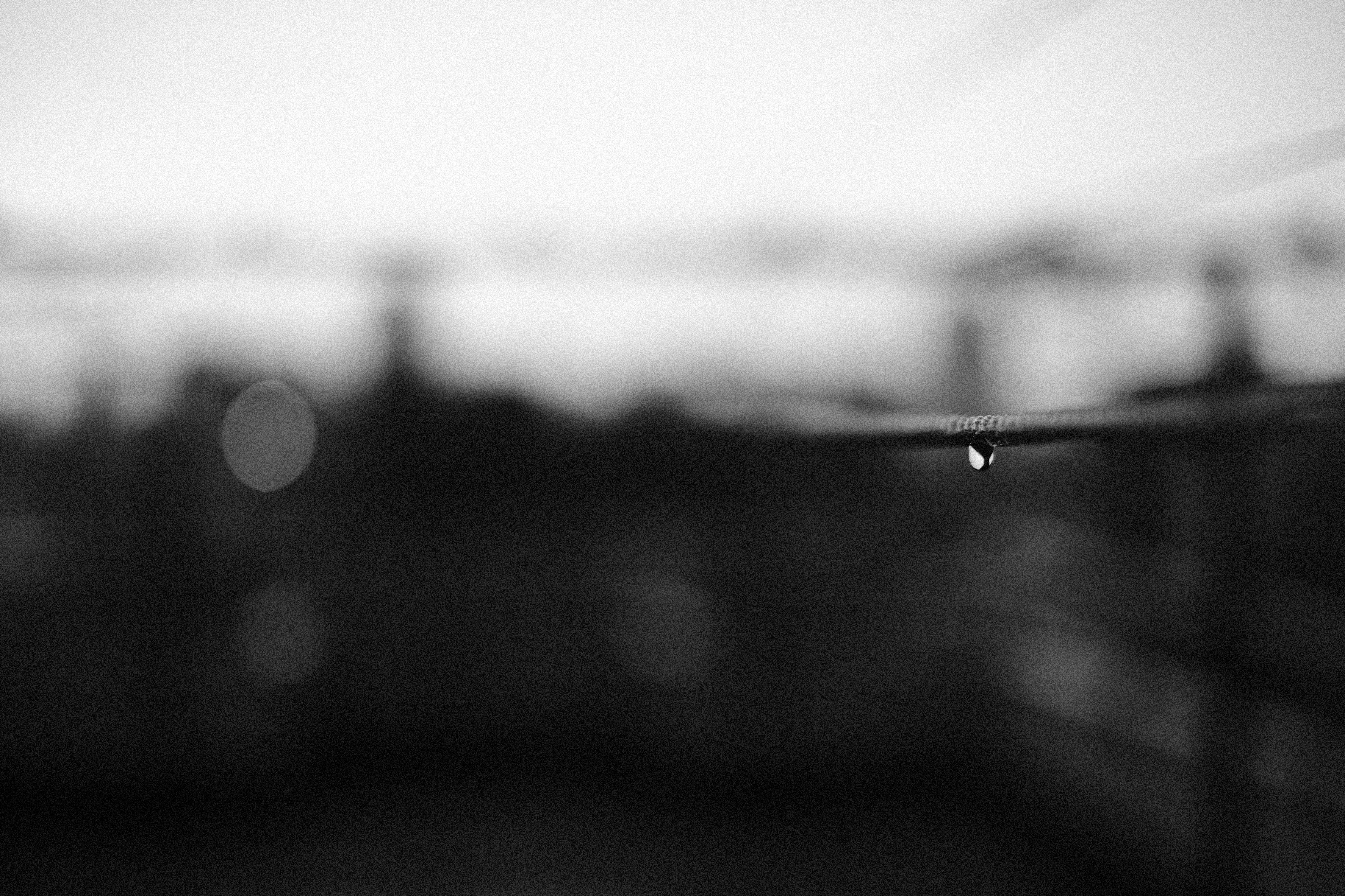 a black and white photo of a raindrop