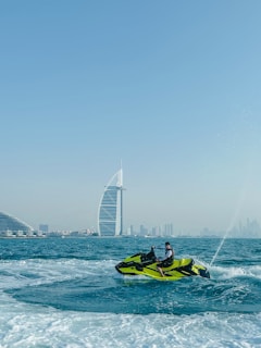 a man riding a jet ski on top of a body of water