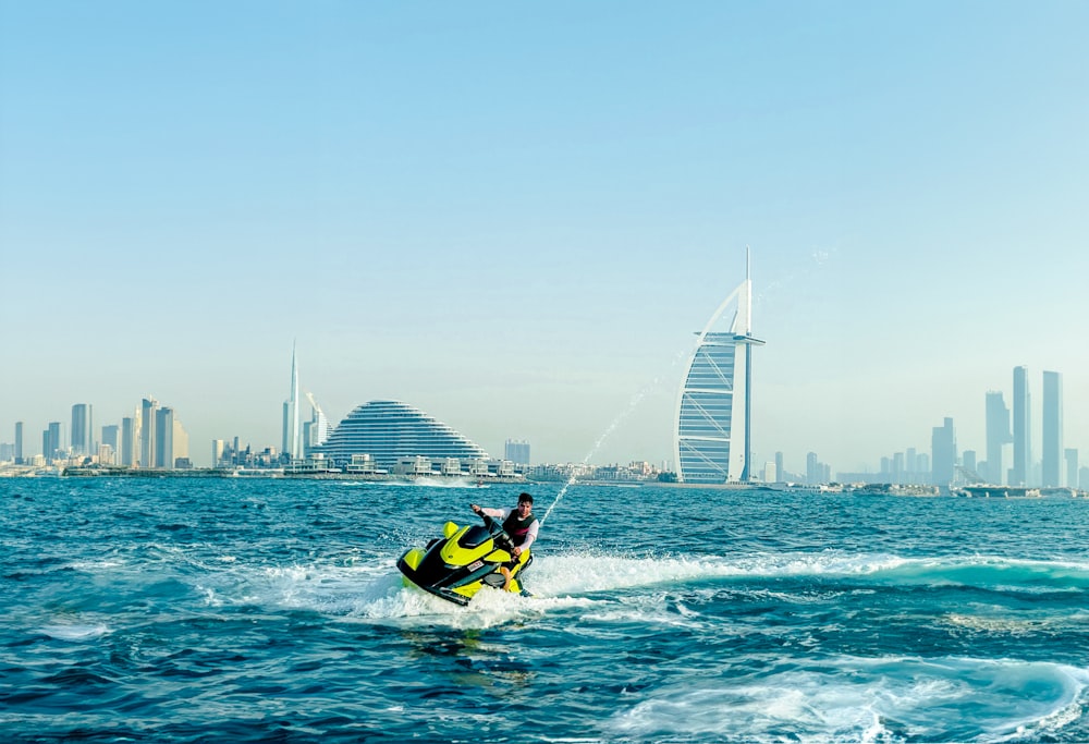 a man riding a jet ski on top of a body of water