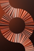 A visually striking design featuring a series of concentric circles and swirling patterns composed of multicolored lines. The lines create a dynamic, flowing effect that draws the eye across the image.